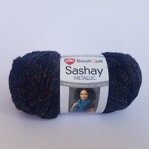 Red Heart Boutique Sashay Metallic Ruffle Mesh Yarn in Onyx 3.5 oz. / 30 yards